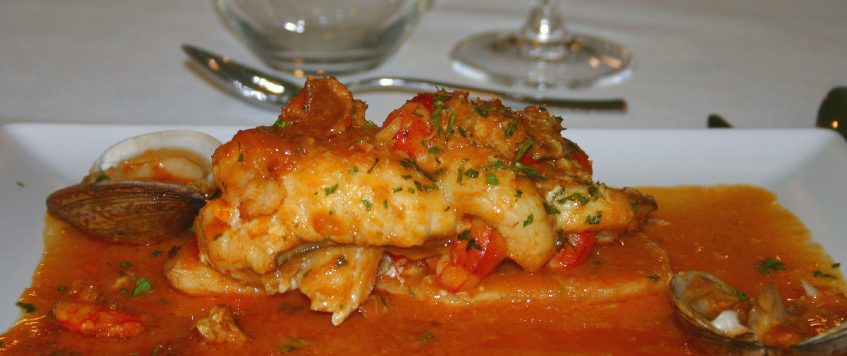 Rape con crema de centollo y almejas